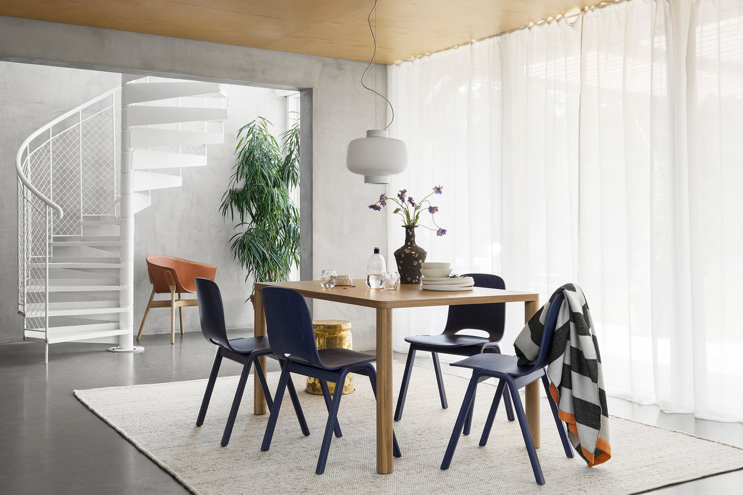 Hem - dining room scene featuring Dune Rug, Dusk Lamp Large, Touchwood Chairs and Log Table.