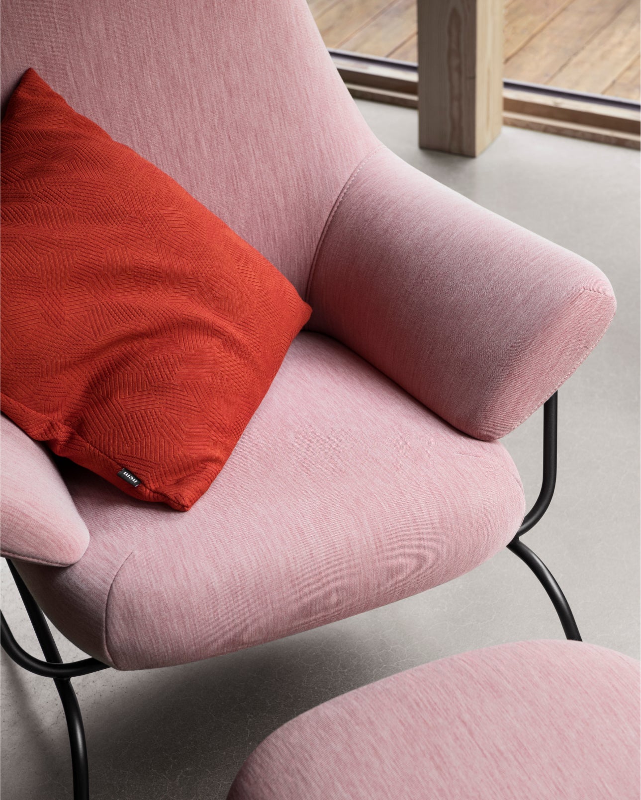 Pink Hai Lounge Chair and Ottoman close-up with Storm Cushion in Flame