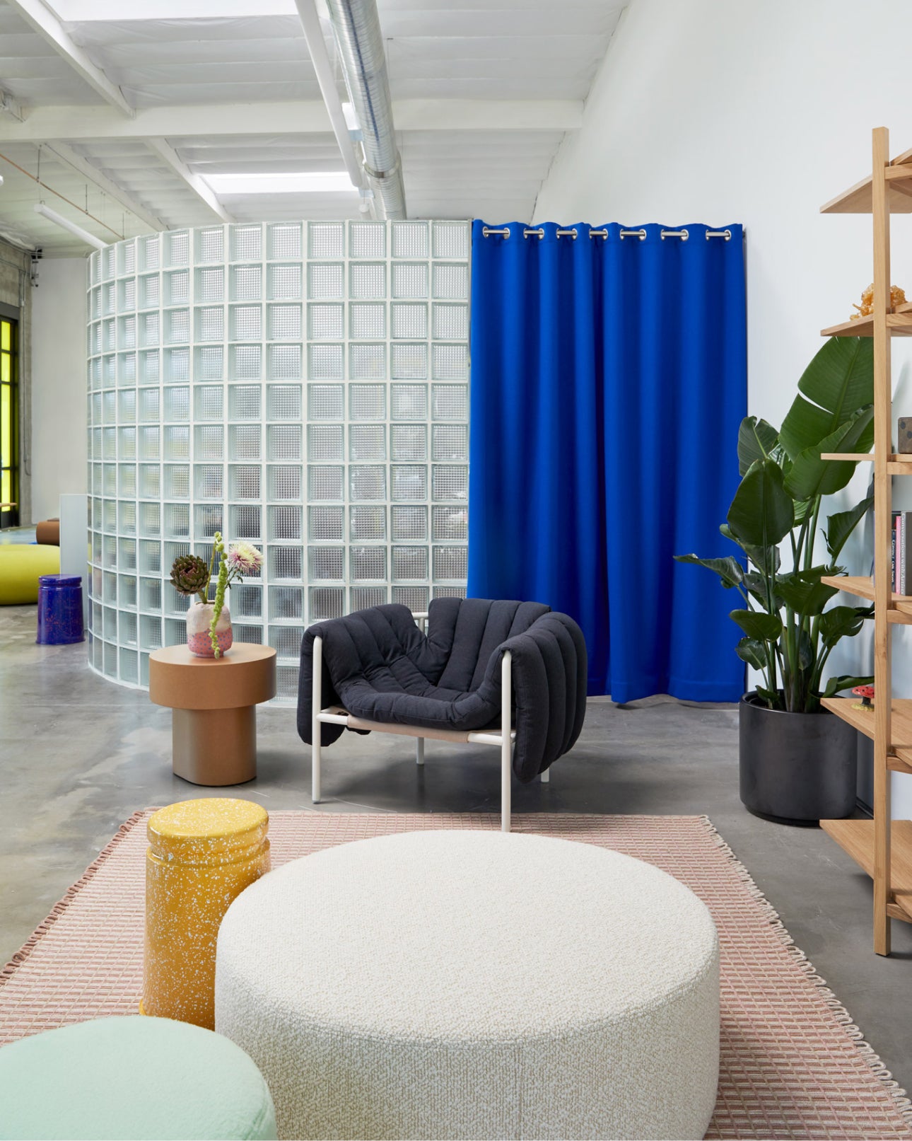 Hem - An image from our LA Showroom featuring Boa Pouf, Puffy Lounge Chair, Zig Zag High Shelf, Rope Rug Large, Stump Table, Bon Pouf Round Large, and more.