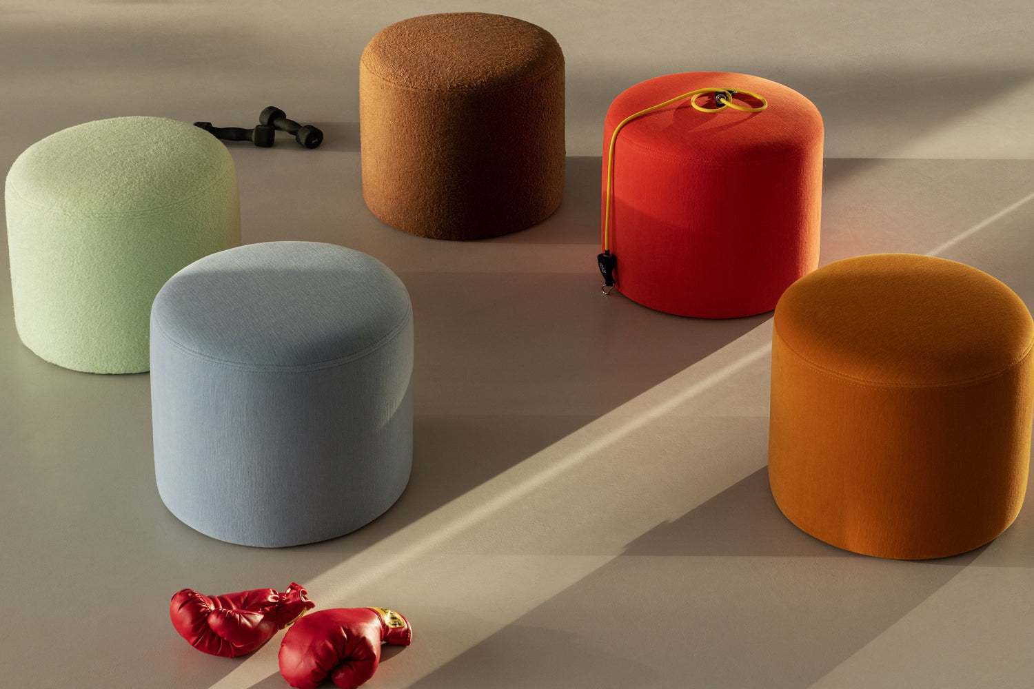 An image of 5 Bon Pouf Round poufs in the shades Brown, Mint, Light Blue, Ochre and Red.