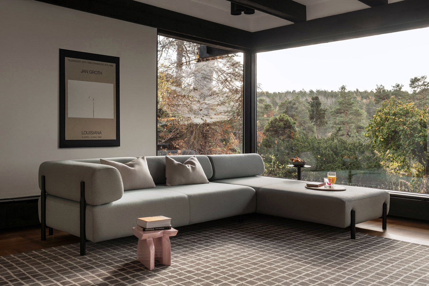 A living room scene featuring a Palo Modular Corner Sofa Right in Beige above a Grid Rug.
